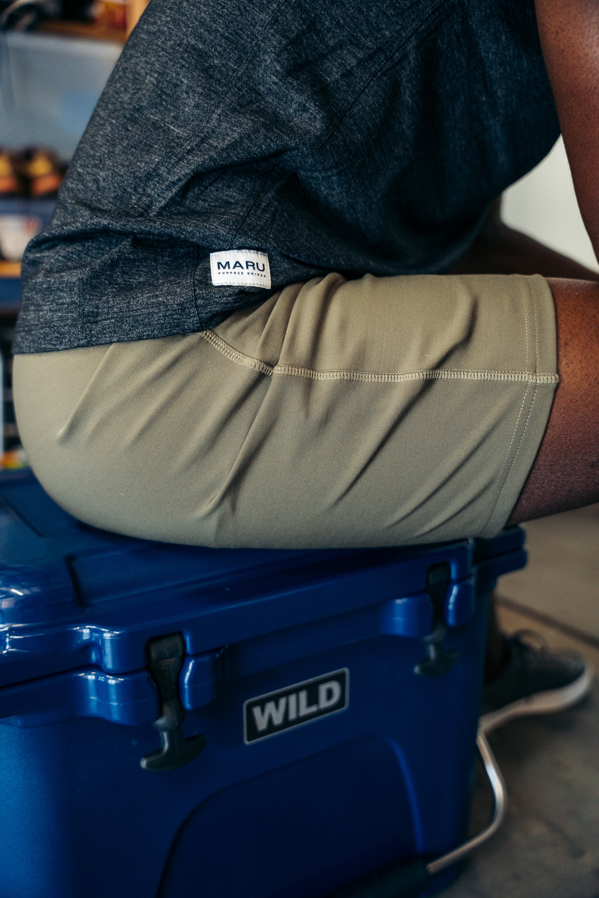 Sitting on a cooler box dressed in Maru Clothing