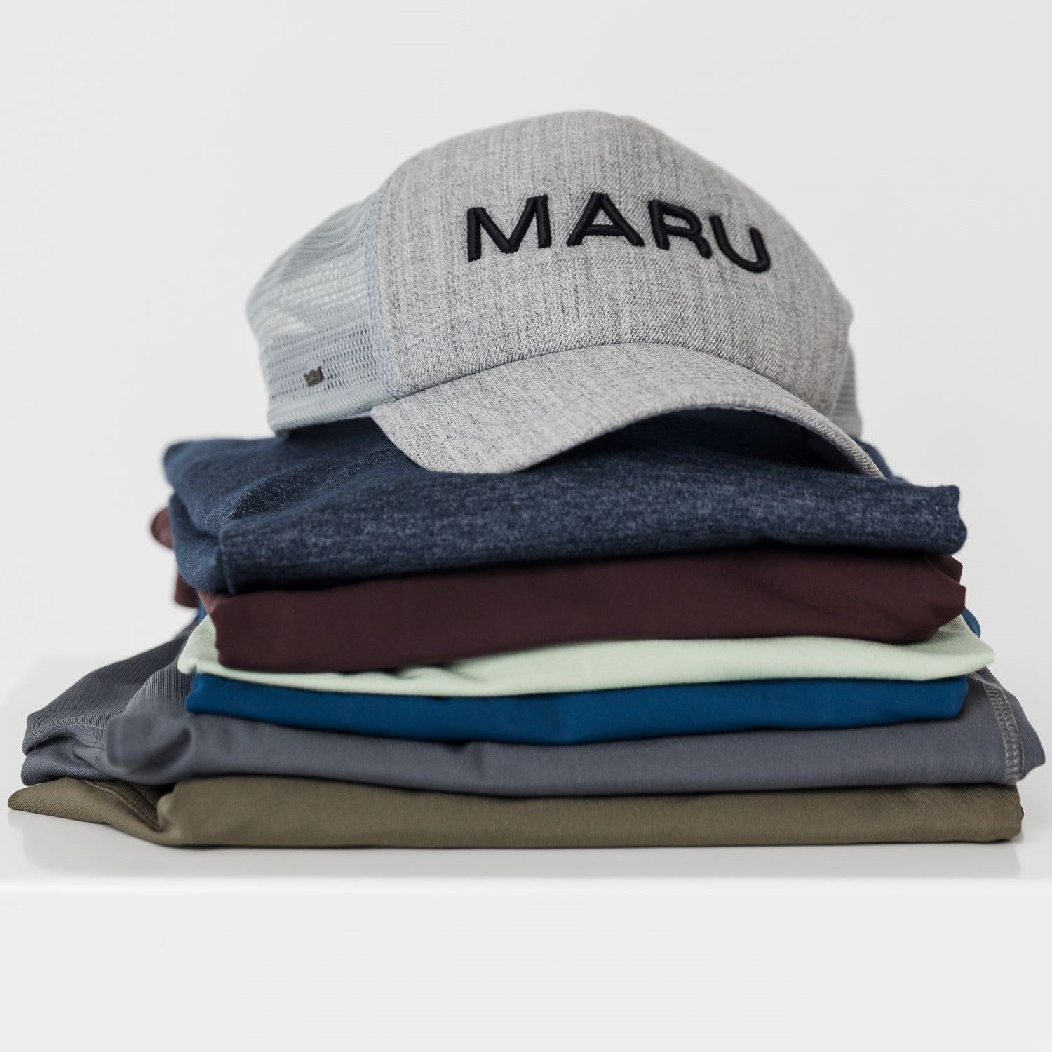 Maru Clothing and cap folded and stock piled 