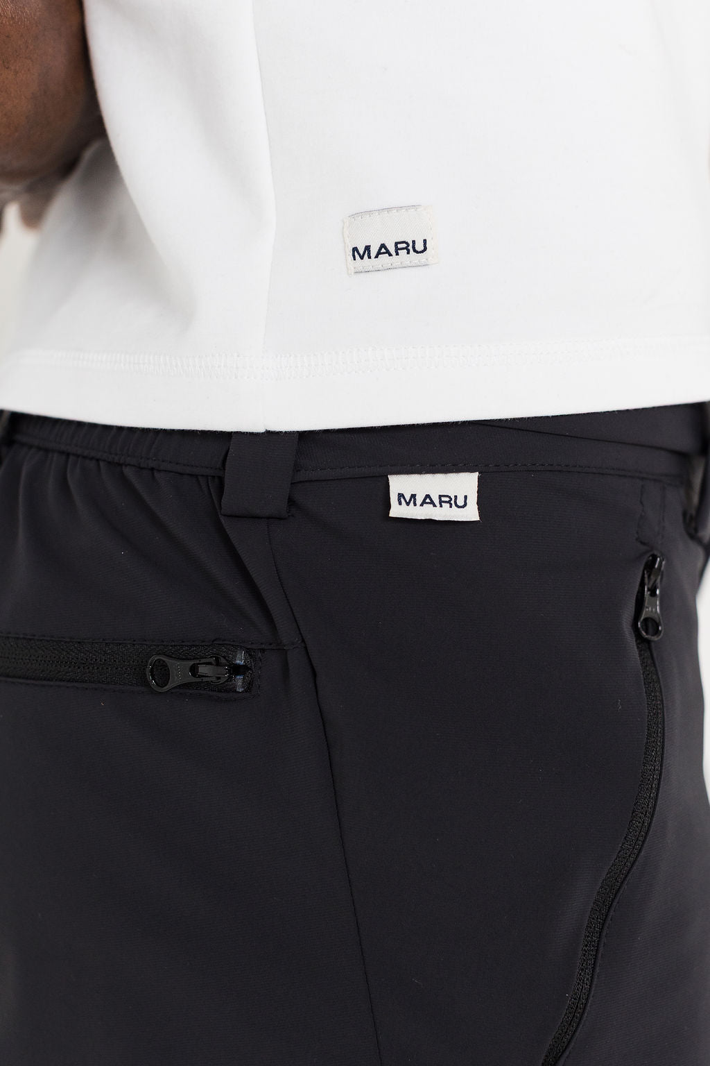 Black pants with a visible MARU label on a white background