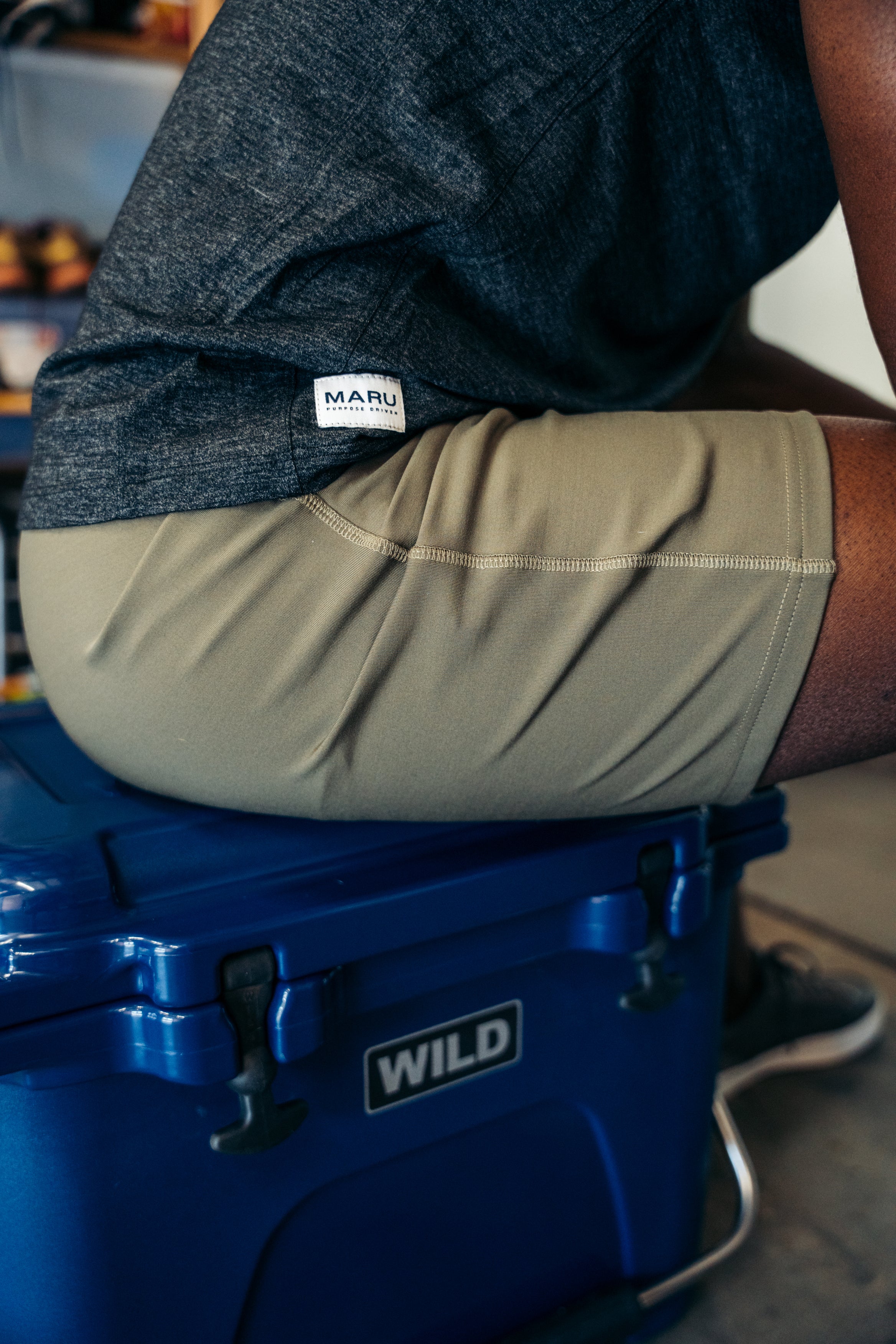 Sitting on a cooler box dressed in Maru Clothing 