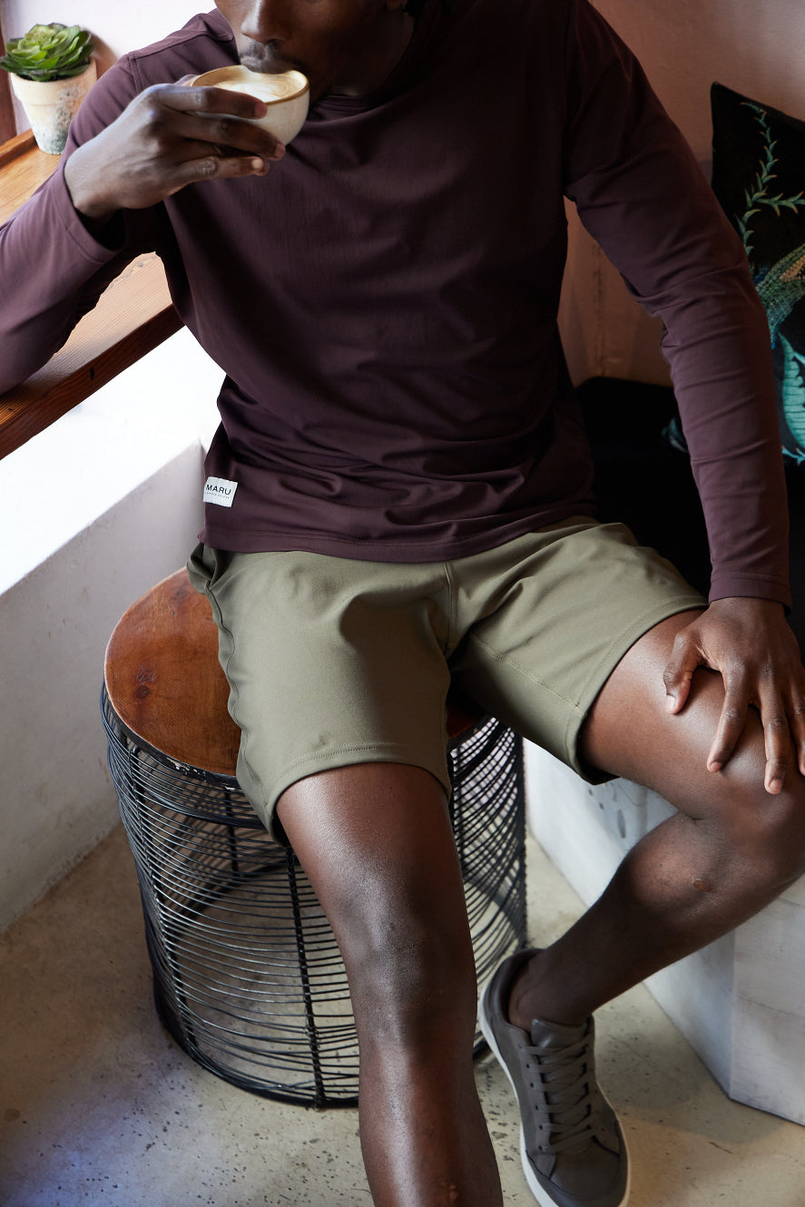 Having coffee dressed in the Lifestyle shorts and The Banker Long Sleeve Tee Maru Clothing 